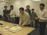 Simon takes over cutting the cake